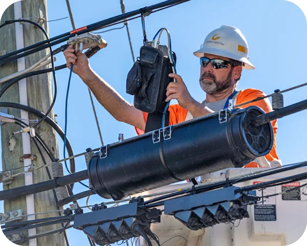 Comporium technician working on communication lines.